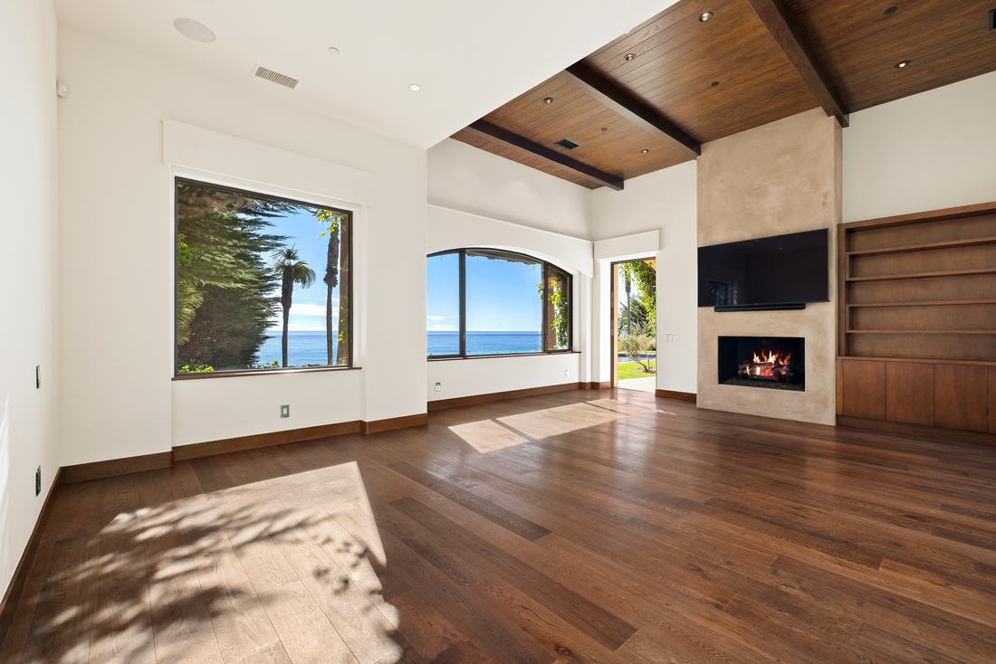 A primary suite, fireplace and ocean windows